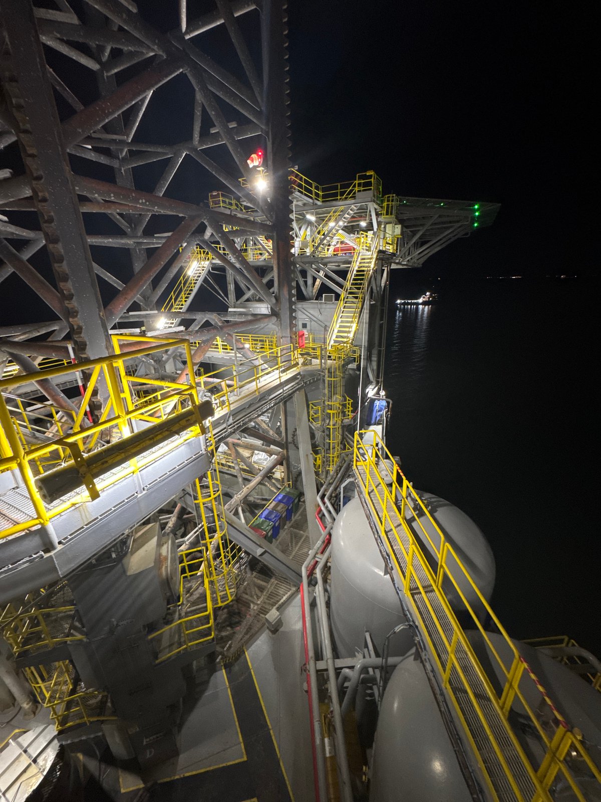 Industrial facility illuminated at night in Italy