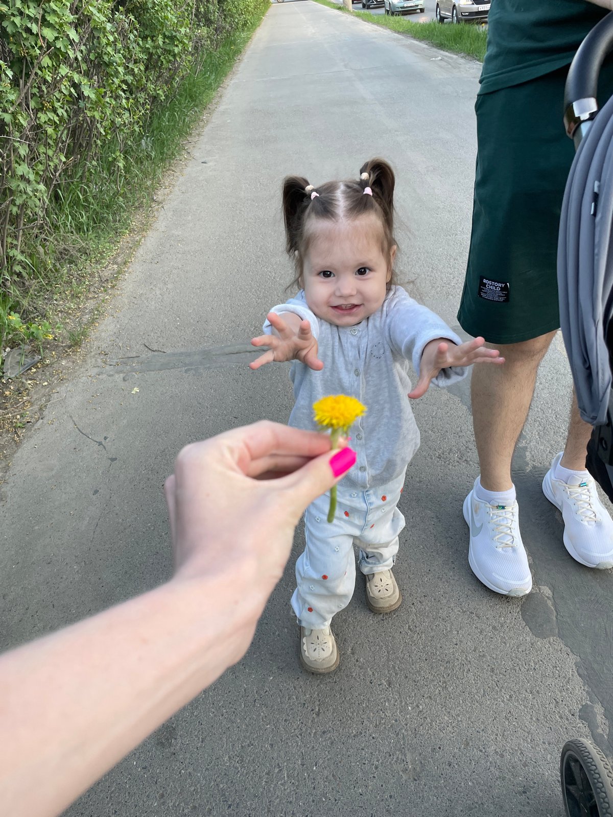 Woman and child share dandelion moment in Izhevsk
