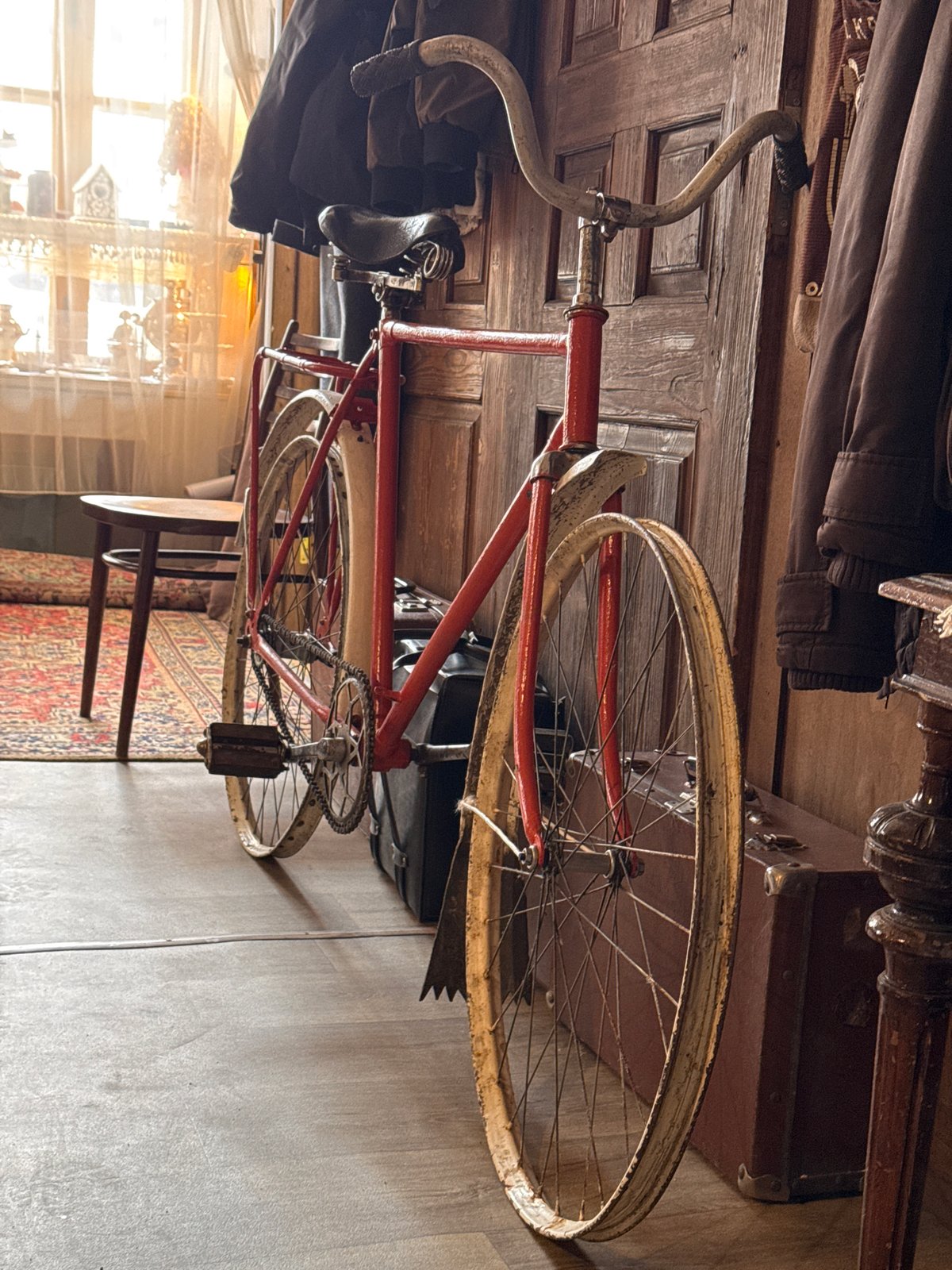Morning scenes in Kladovitsy: vintage bicycle, sparrow on weathered wood