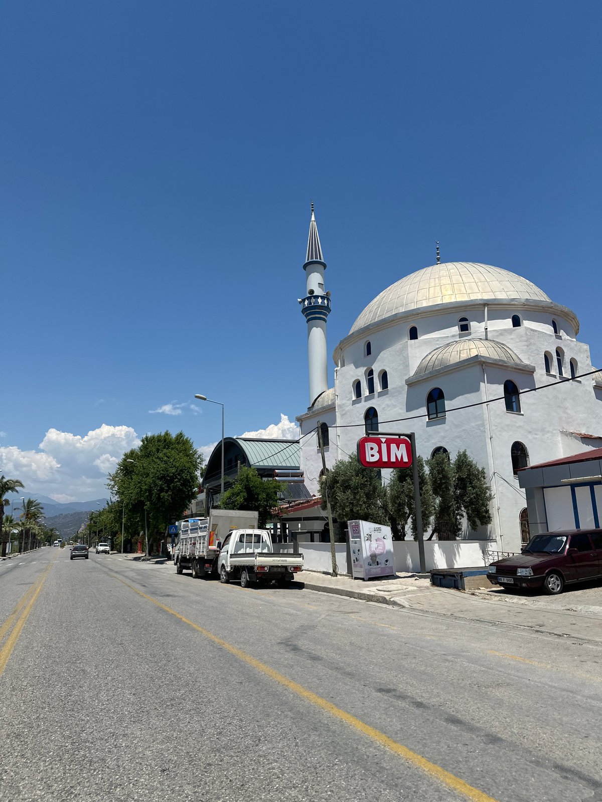 White mosque photographed on Fethiye street under clear skies