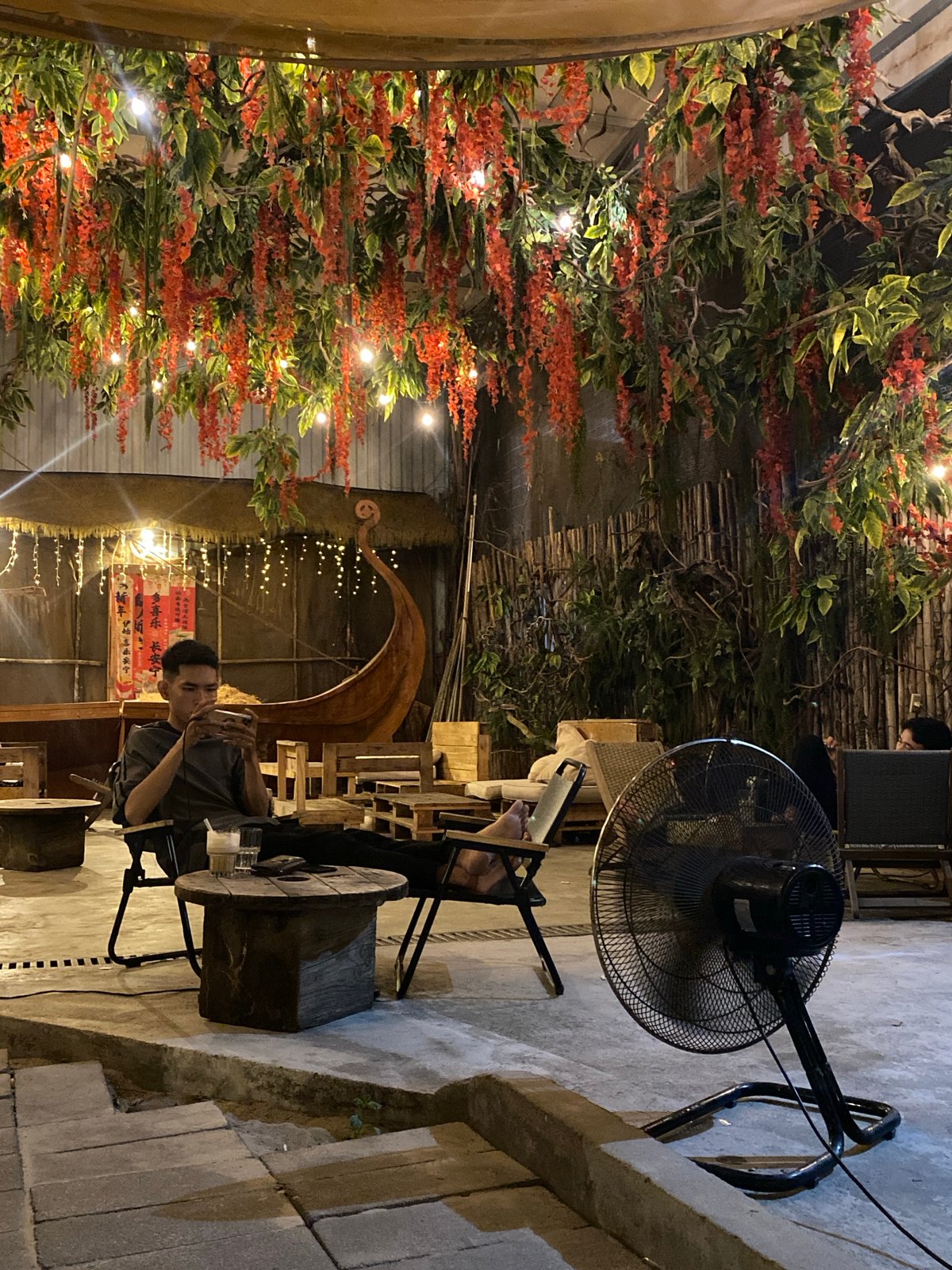 Evening hang at a leafy outdoor café in Nha Trang