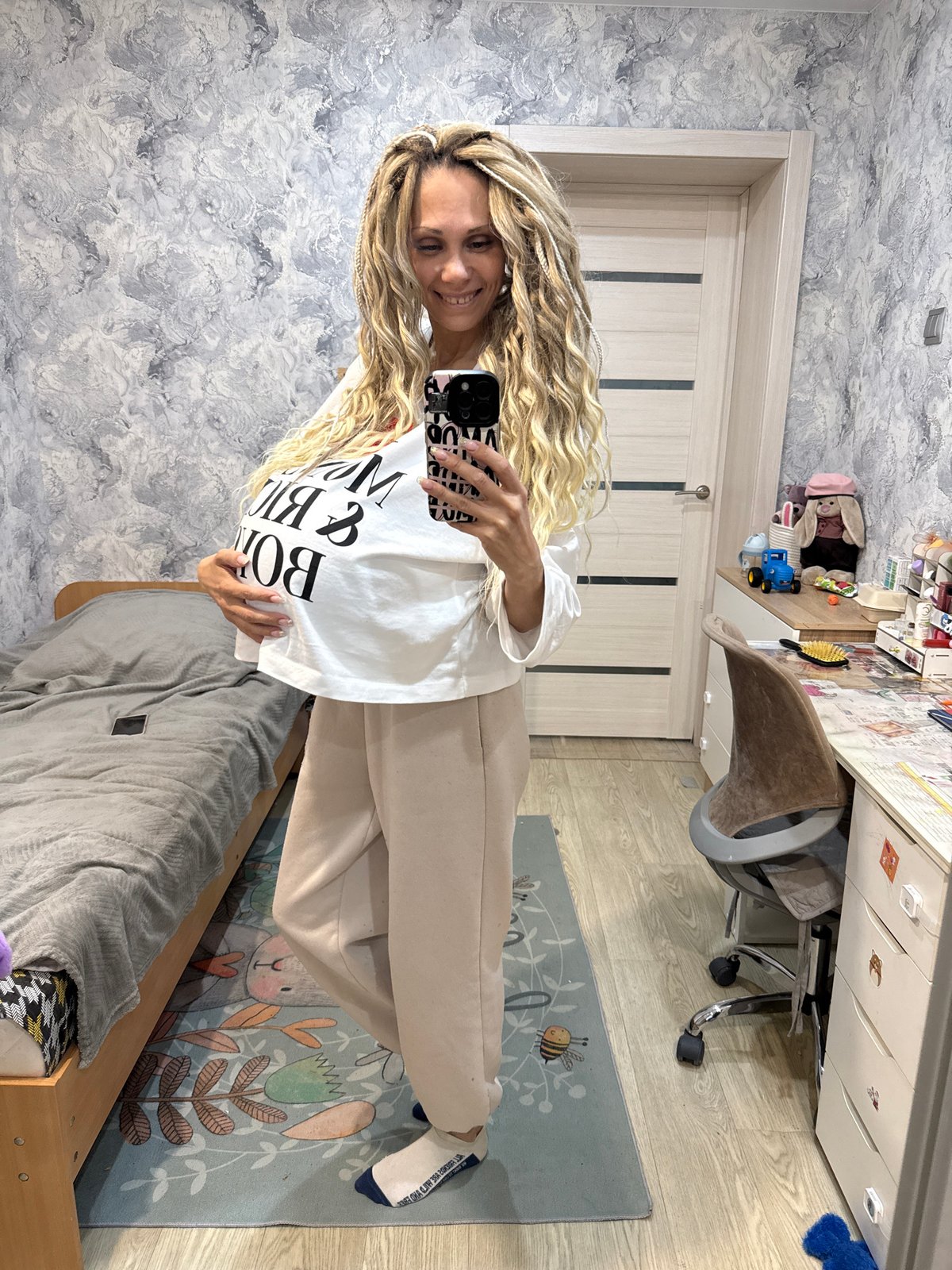 Woman takes mirror selfie in Rusanovo, Russia