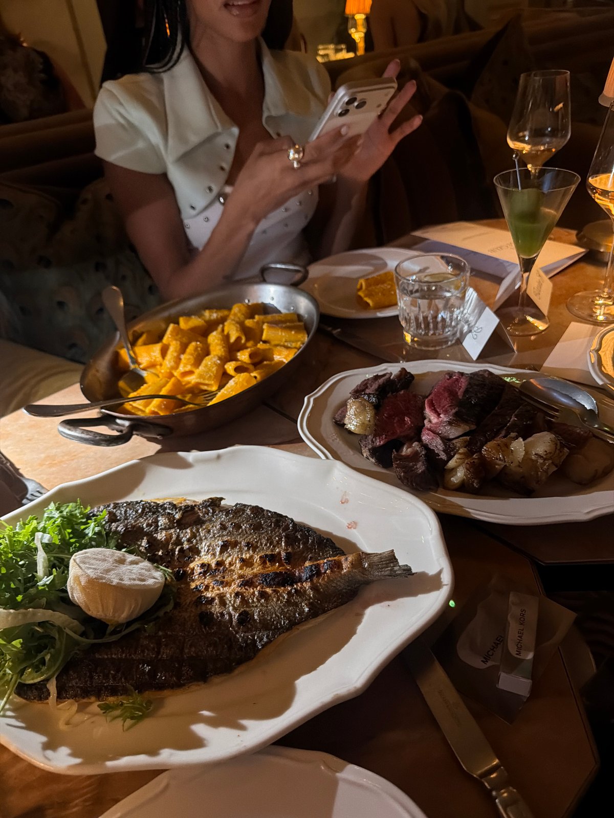 Dinner spread at a dimly lit London restaurant