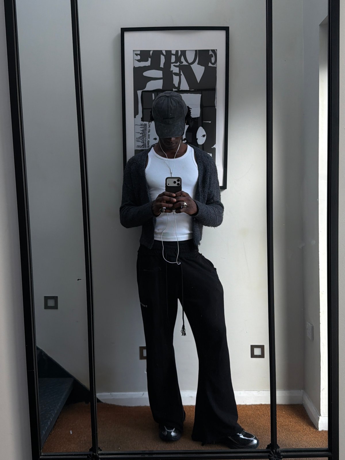 Mirror selfies taken in London indoor setting