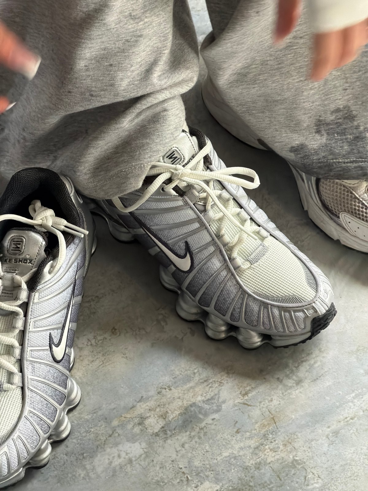 Woman documents athletic shoe selection across Armenia locations