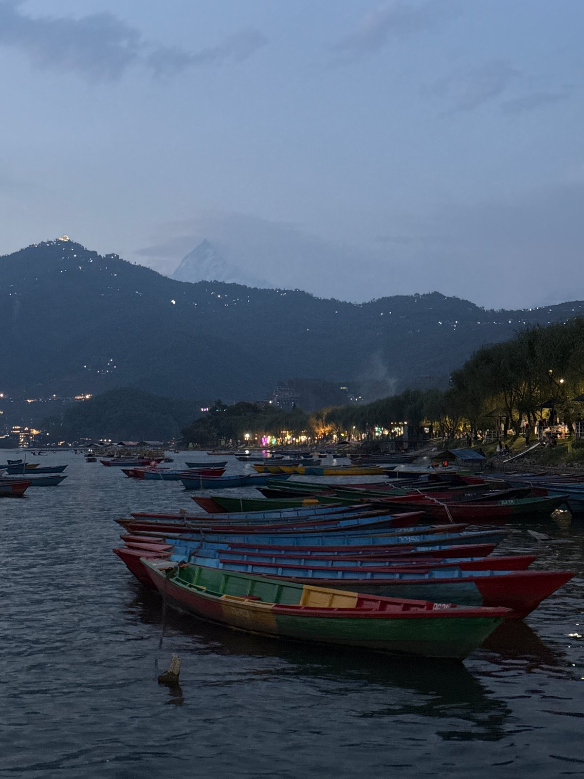 Dusk scenes captured at Phewa Lake, Pokhara with colorful boats