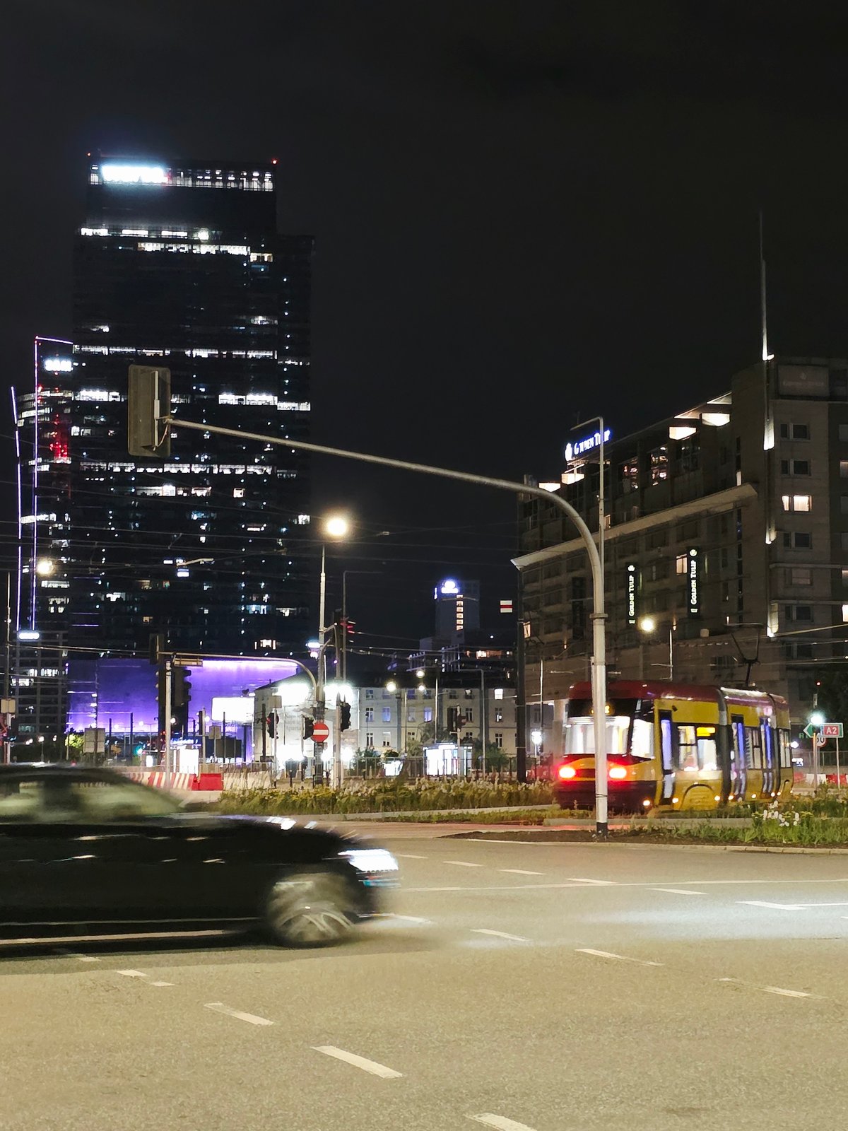 Warsaw city center on a summer night, streets and skyline