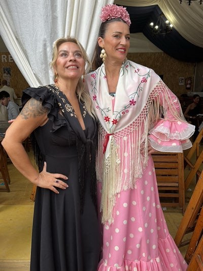 Women in flamenco dress celebrate at Jerez Horse Fair