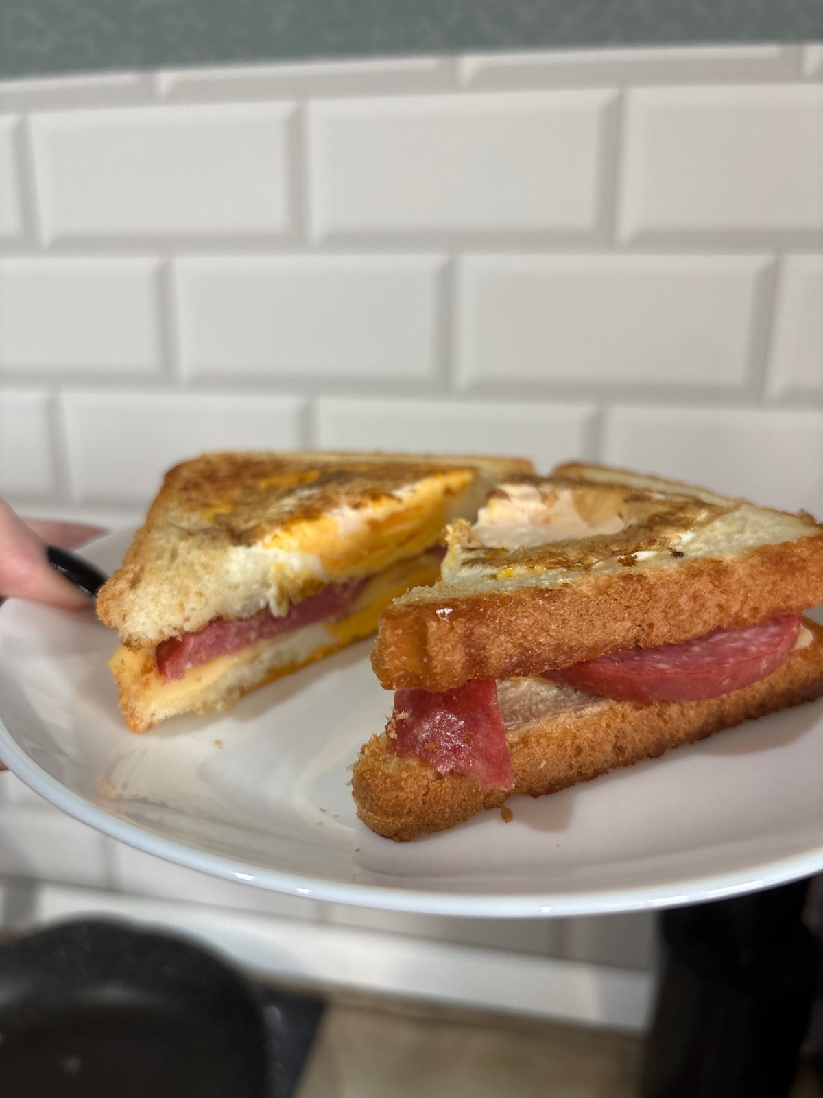 Egg and salami sandwich photographed in Saint Petersburg kitchen