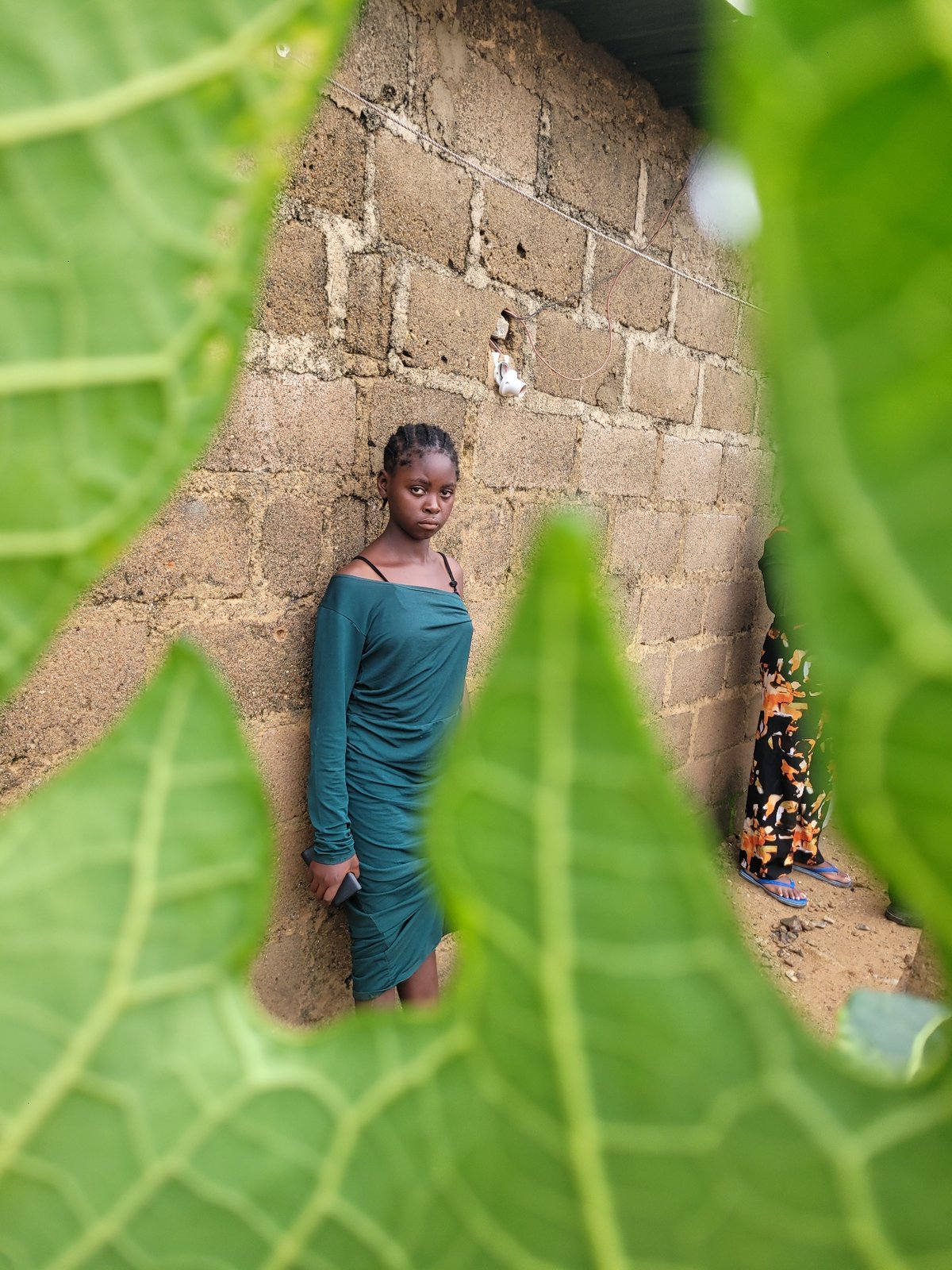 Foggy morning routines in a rural Nigerian compound