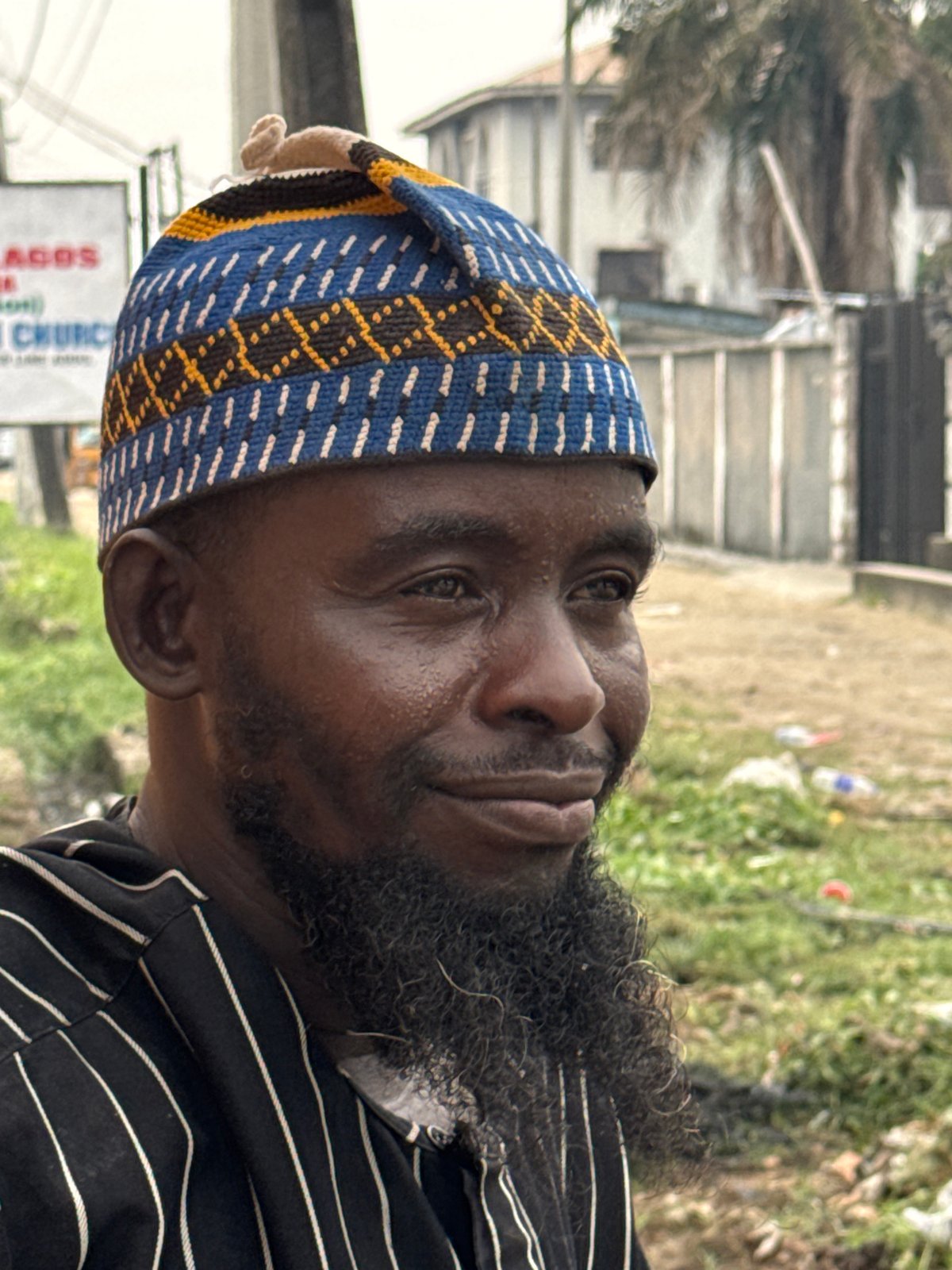 Man in traditional kufi hat photographed in Ado, Nigeria