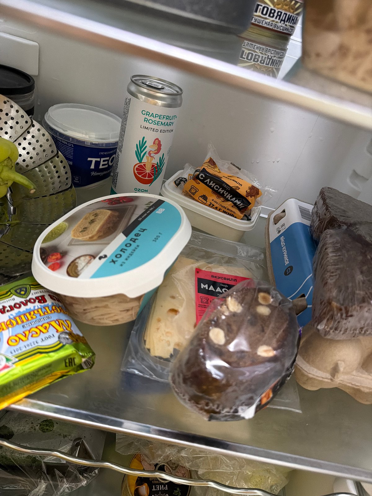 Fridge contents and a green '#oink' graphic, Moscow