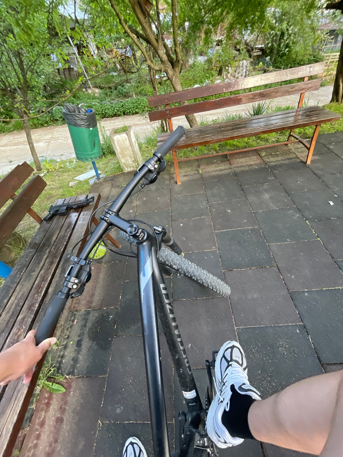 Person cycles, plays with dog, handles pellet gun at Bulgarian playground