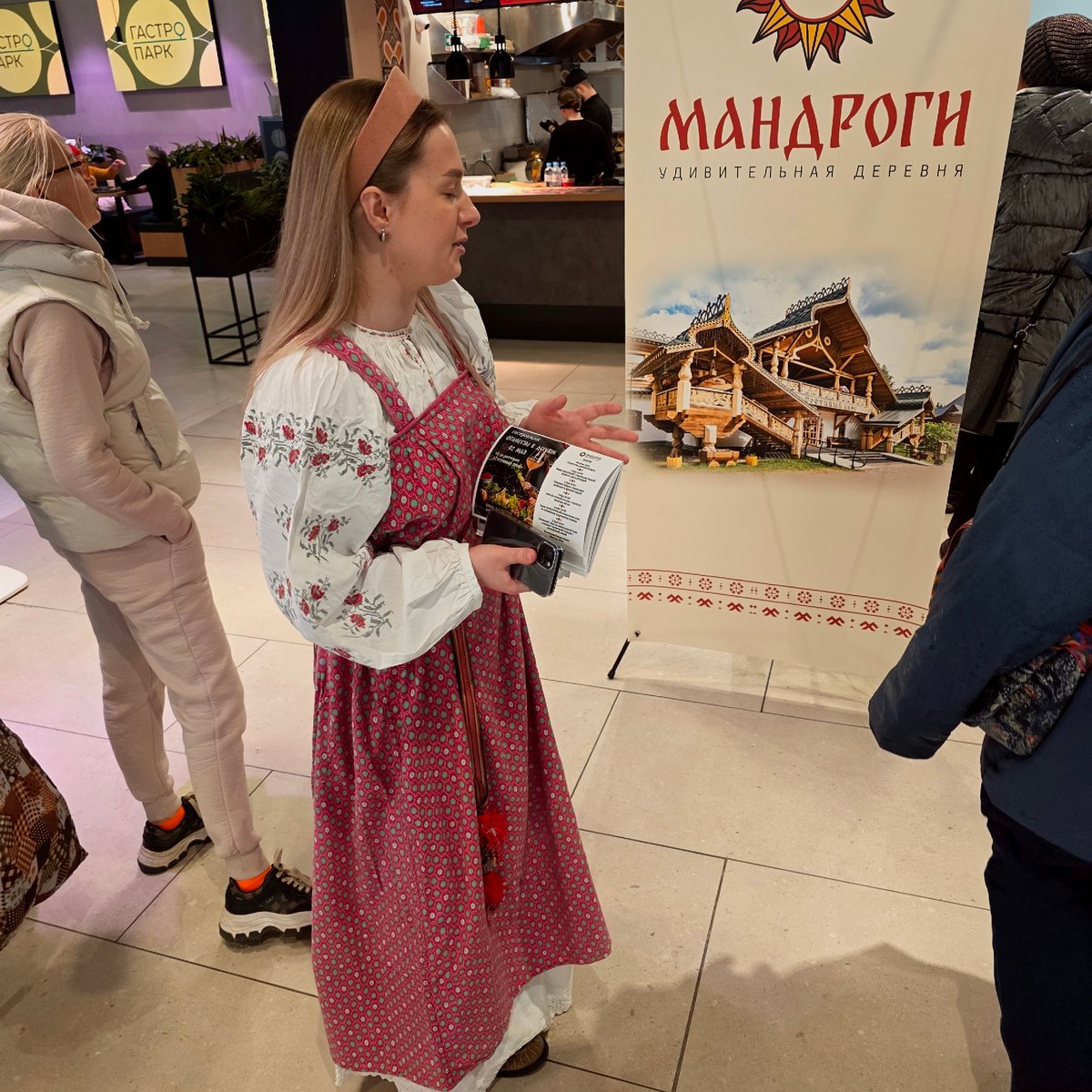 Woman in traditional dress promotes Mandrogi village in Murino