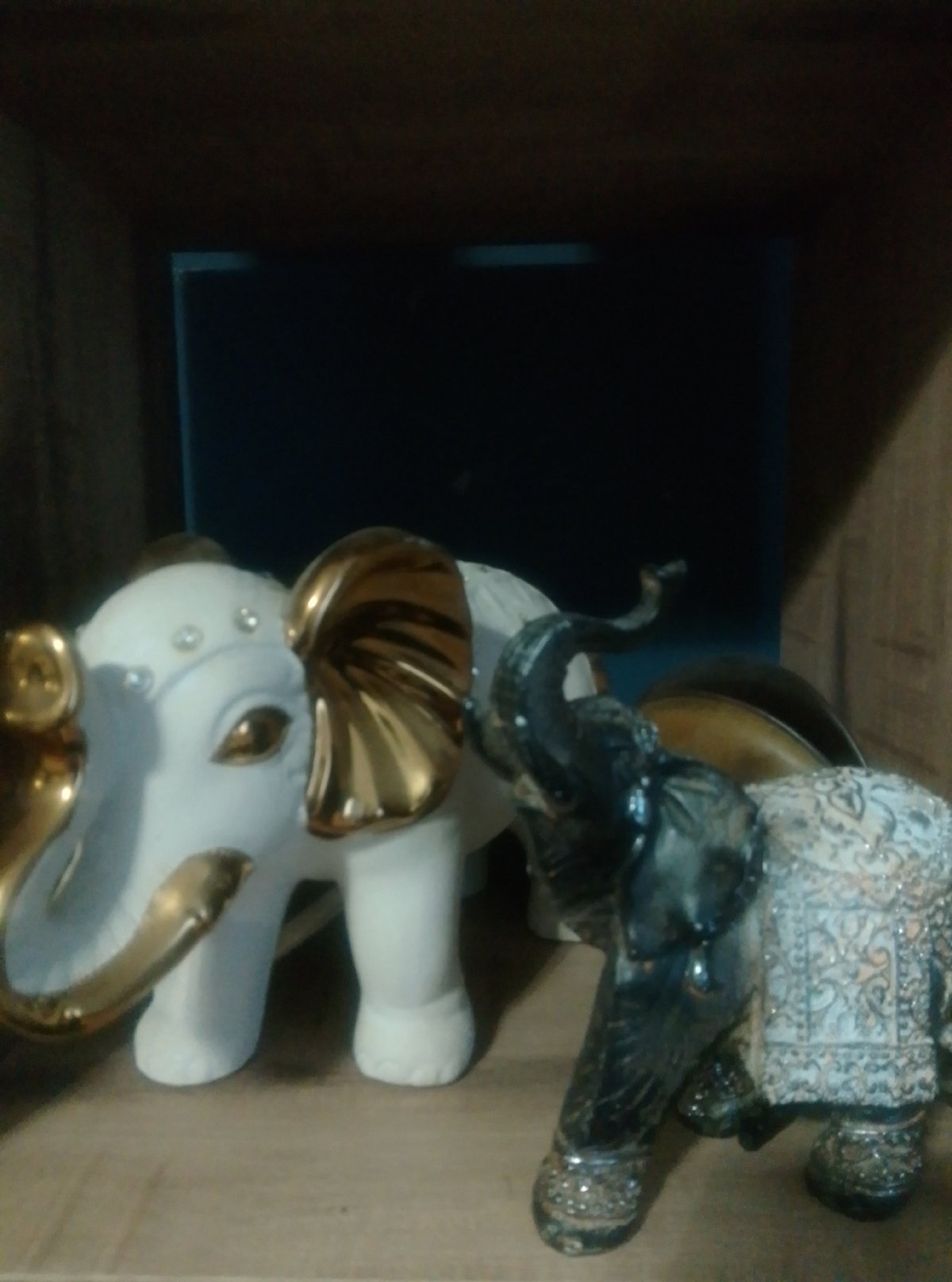 Eclectic shelf of figurines, plush toys, and holiday decorations