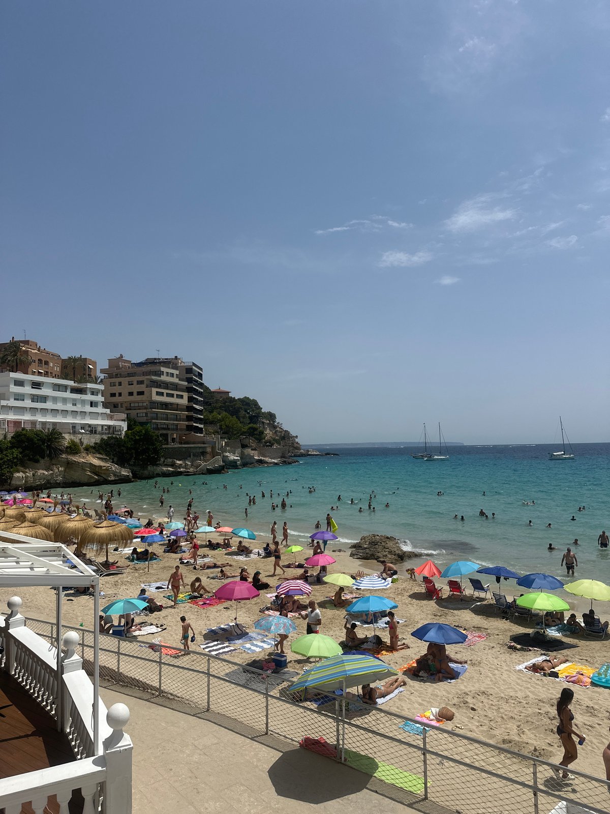 Crowded beaches and clear water along Mallorca's Sant Agustí coast