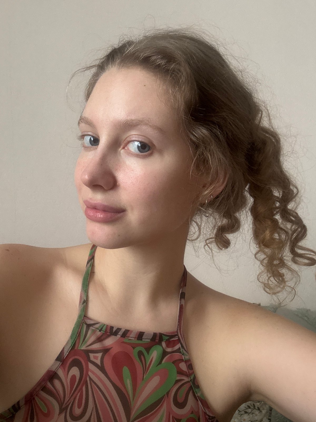 Woman takes selfies with pet budgerigars in Izhevsk apartment