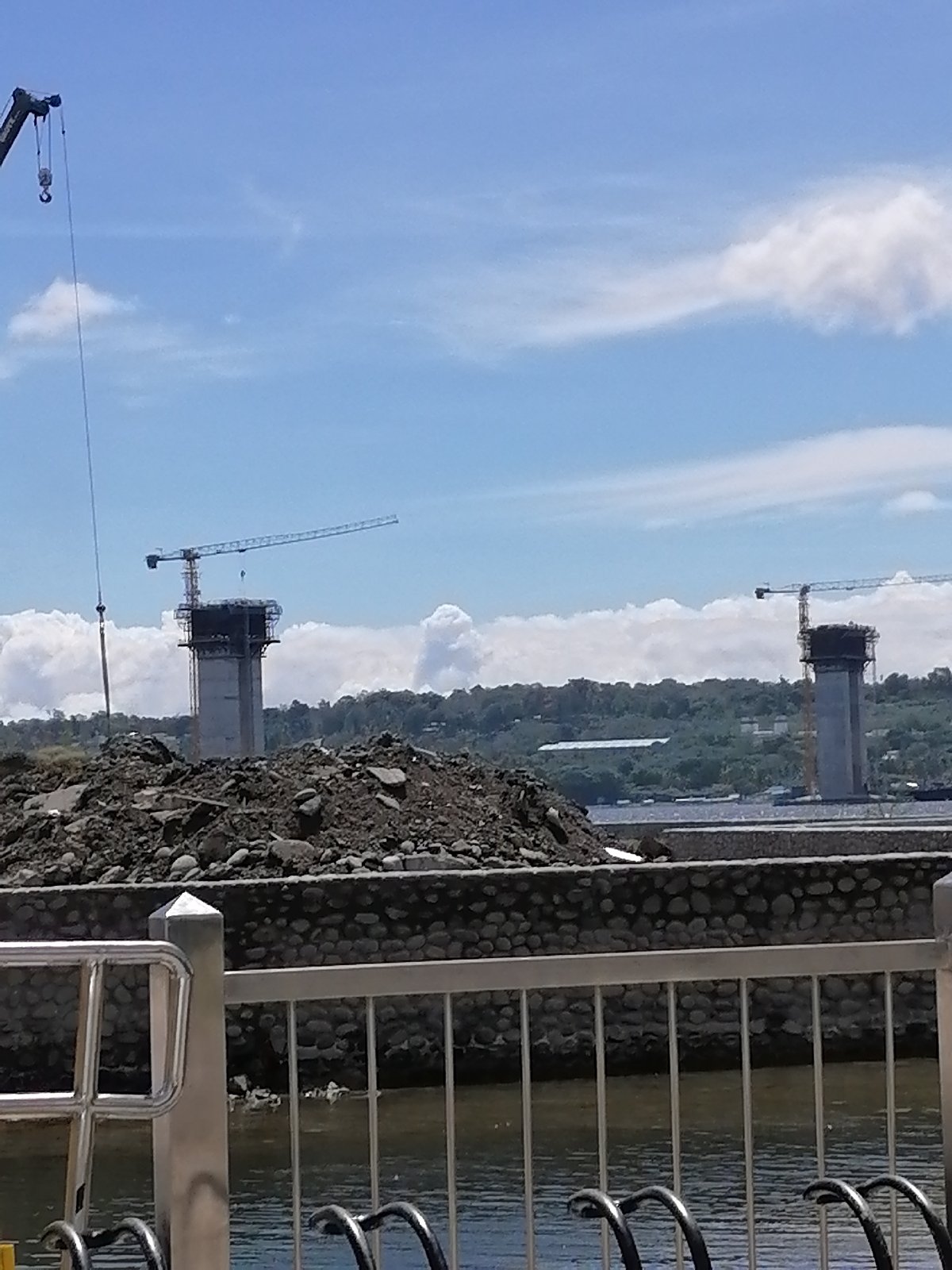Bridge construction continues in Davao City with multiple cranes
