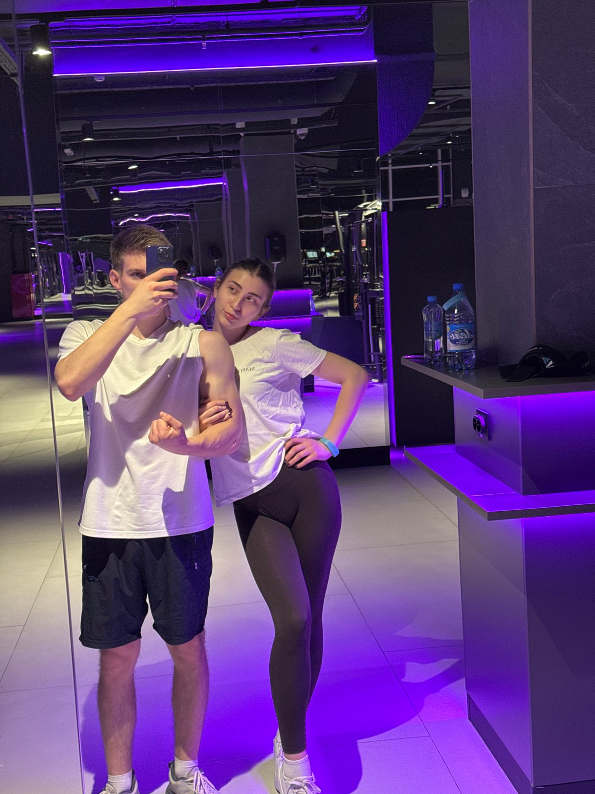 Couple documents workout session at Krasnoyarsk gym with selfies