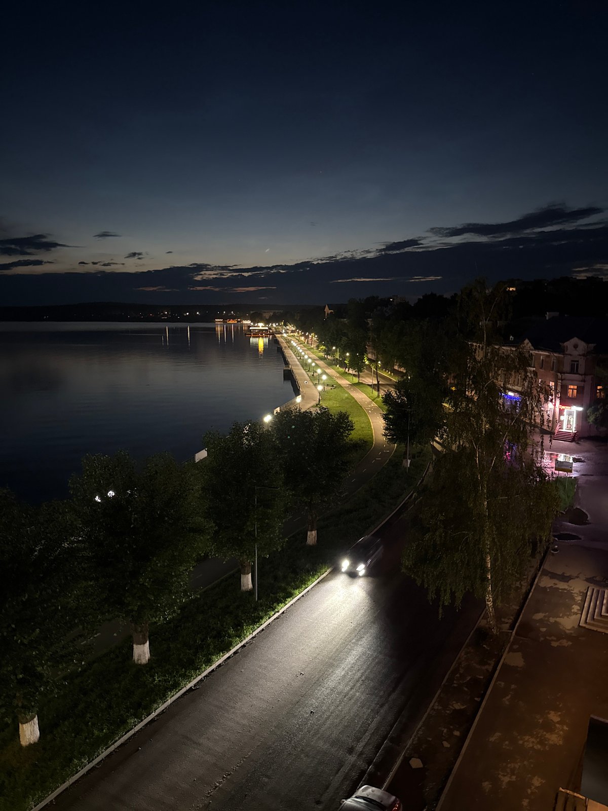 Votkinsk embankment at night, reservoir reflecting city lights