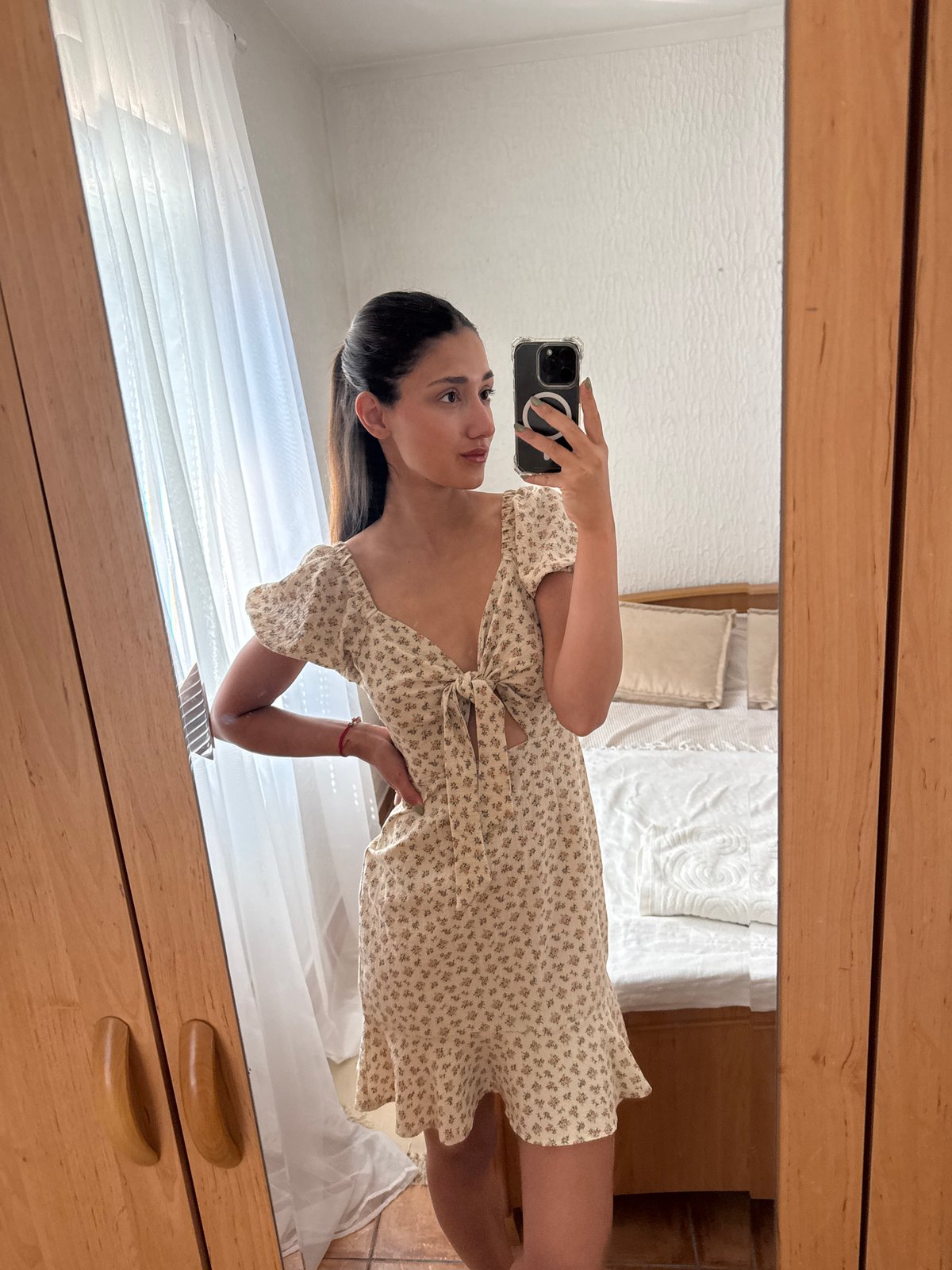 Woman takes selfies in floral dress in Montenegro village