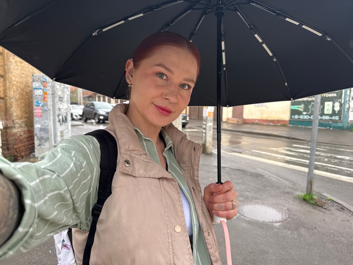 Woman with umbrella observed during rainy morning in Rostov-on-Don