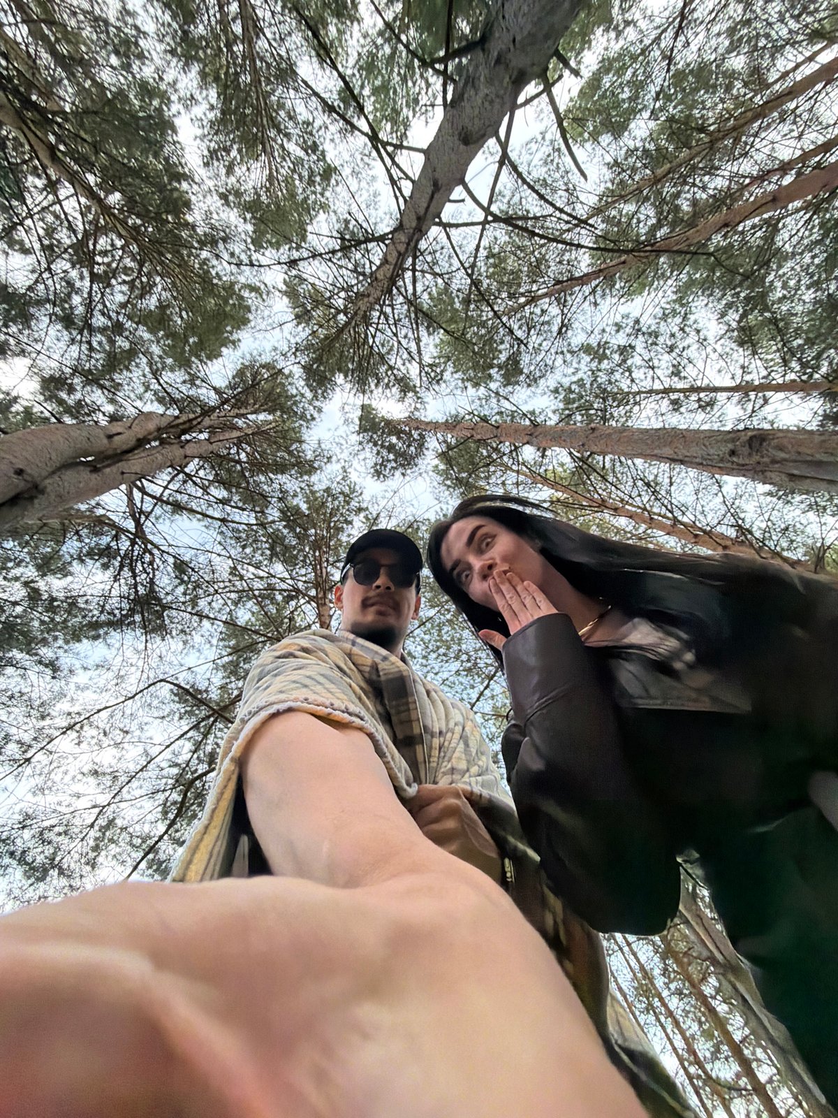 Couple enjoys outdoor photography session in Krasnoyarsk forest