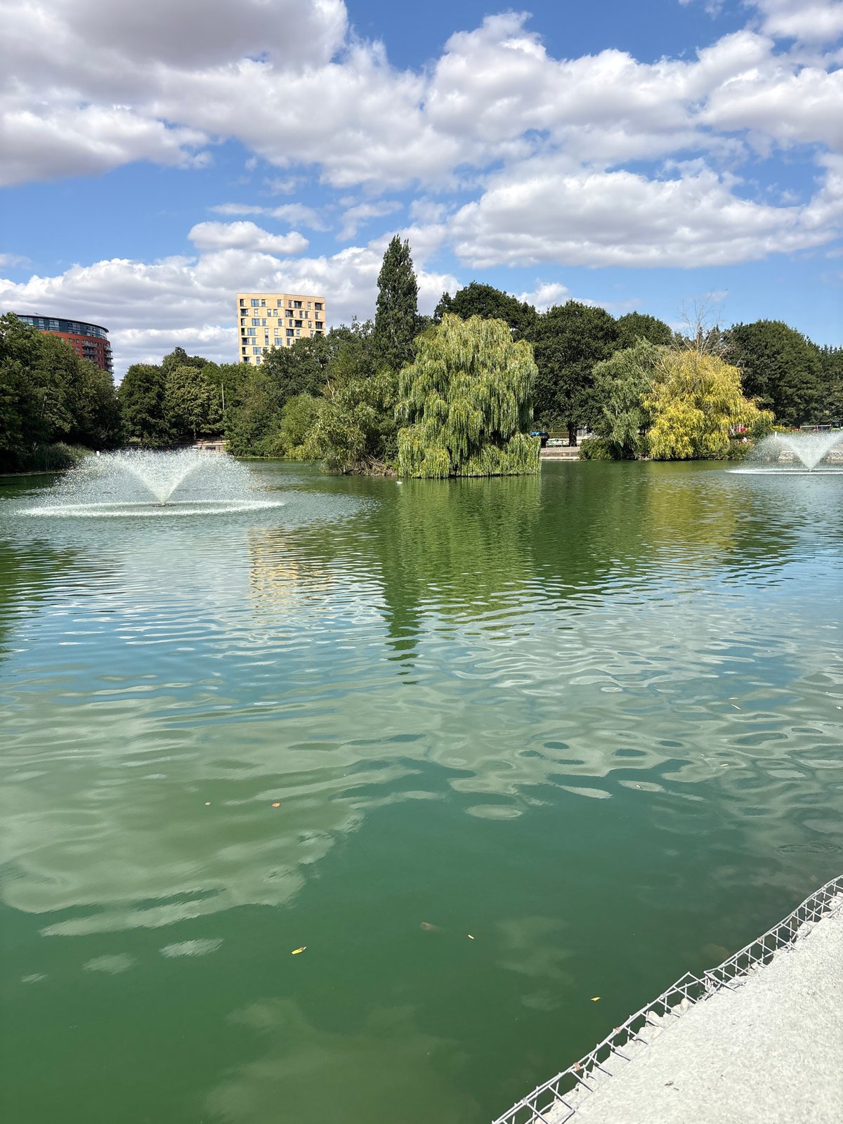 Chelmsford park lake and gardens on a busy summer afternoon