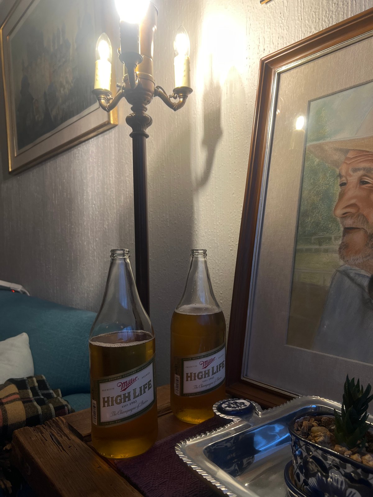 Indoor scene captured with beer bottles and artwork in Mexico City