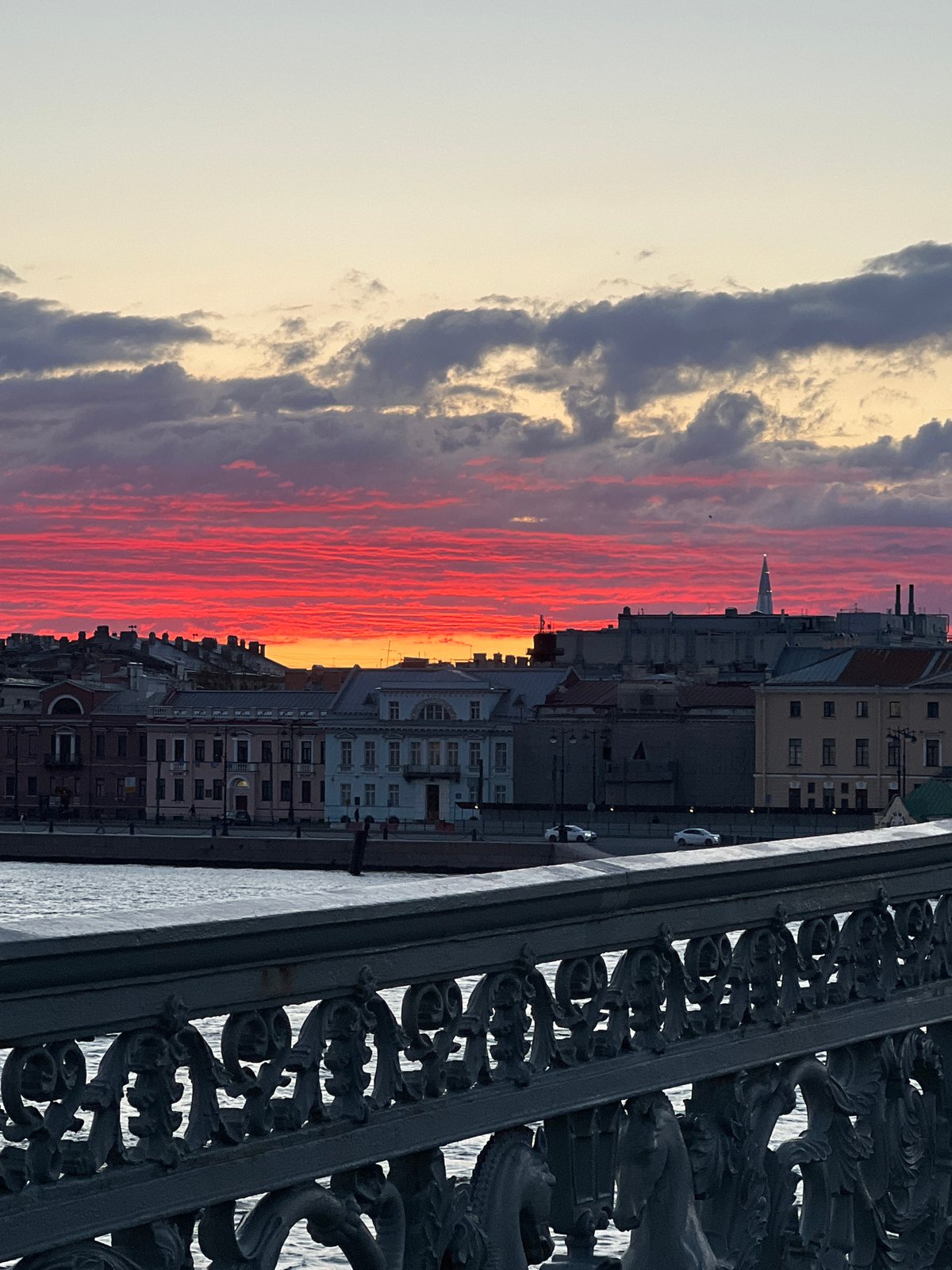 Sunset observed over Saint Petersburg waterfront with research vessels docked