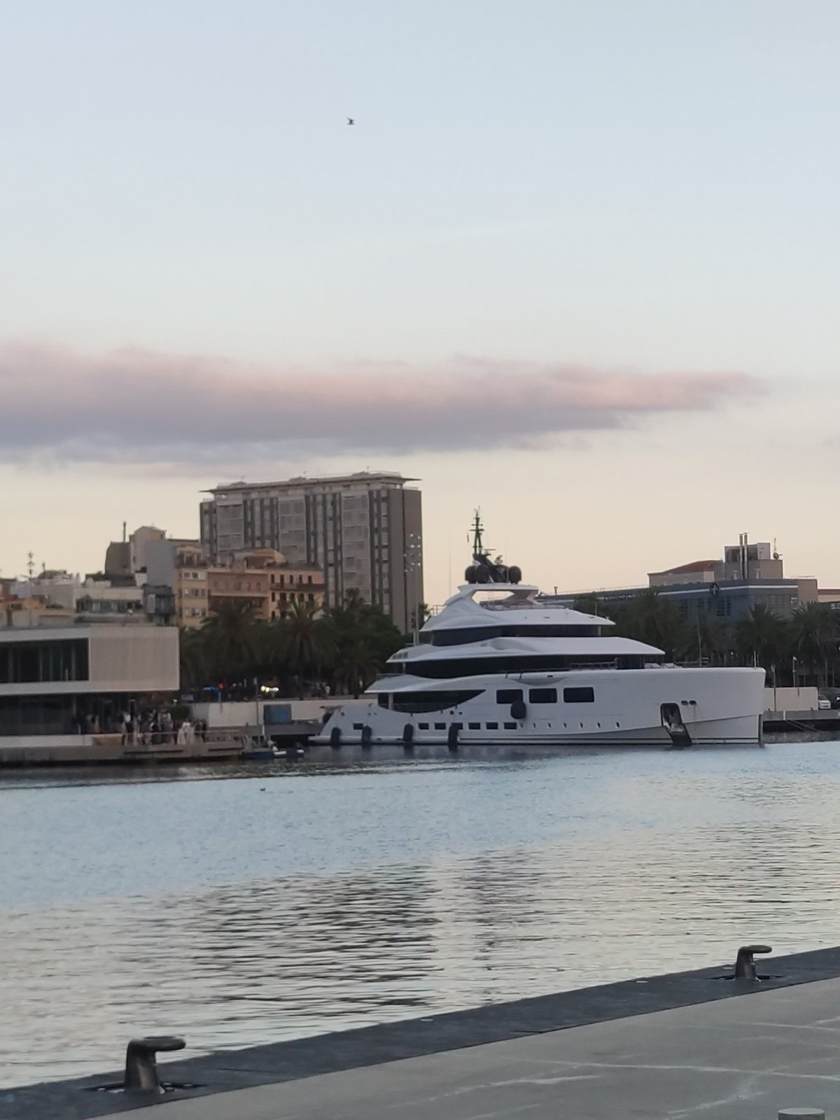 Evening harbor scenes and outdoor performance documented in Barcelona