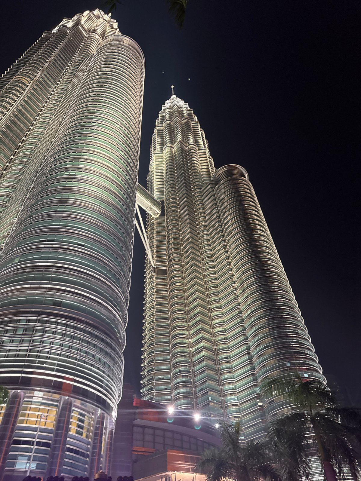 Tourists capture evening photos at Kuala Lumpur's Petronas Towers