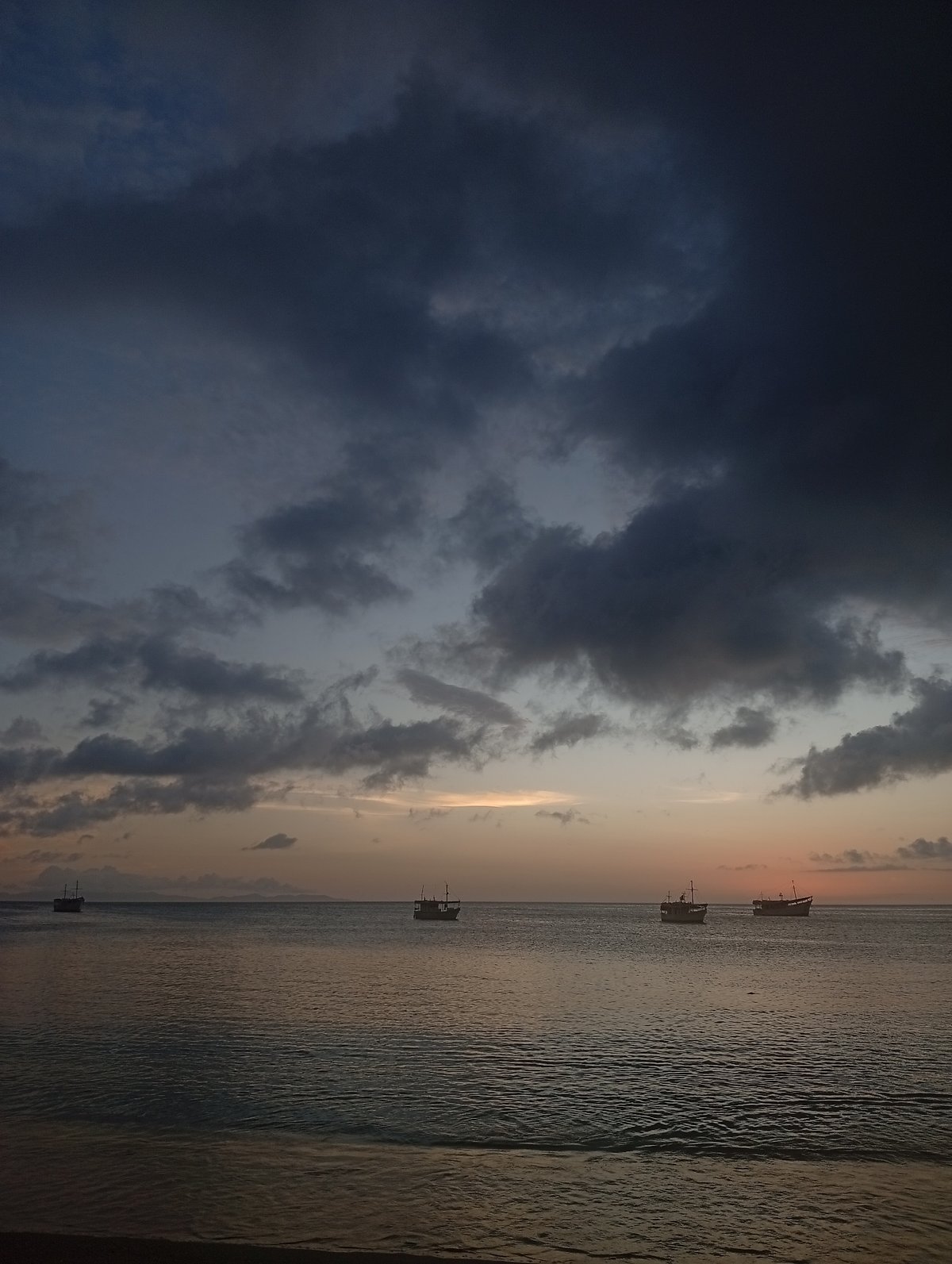 Sunset at the beach, boats on water, casual evening vibes