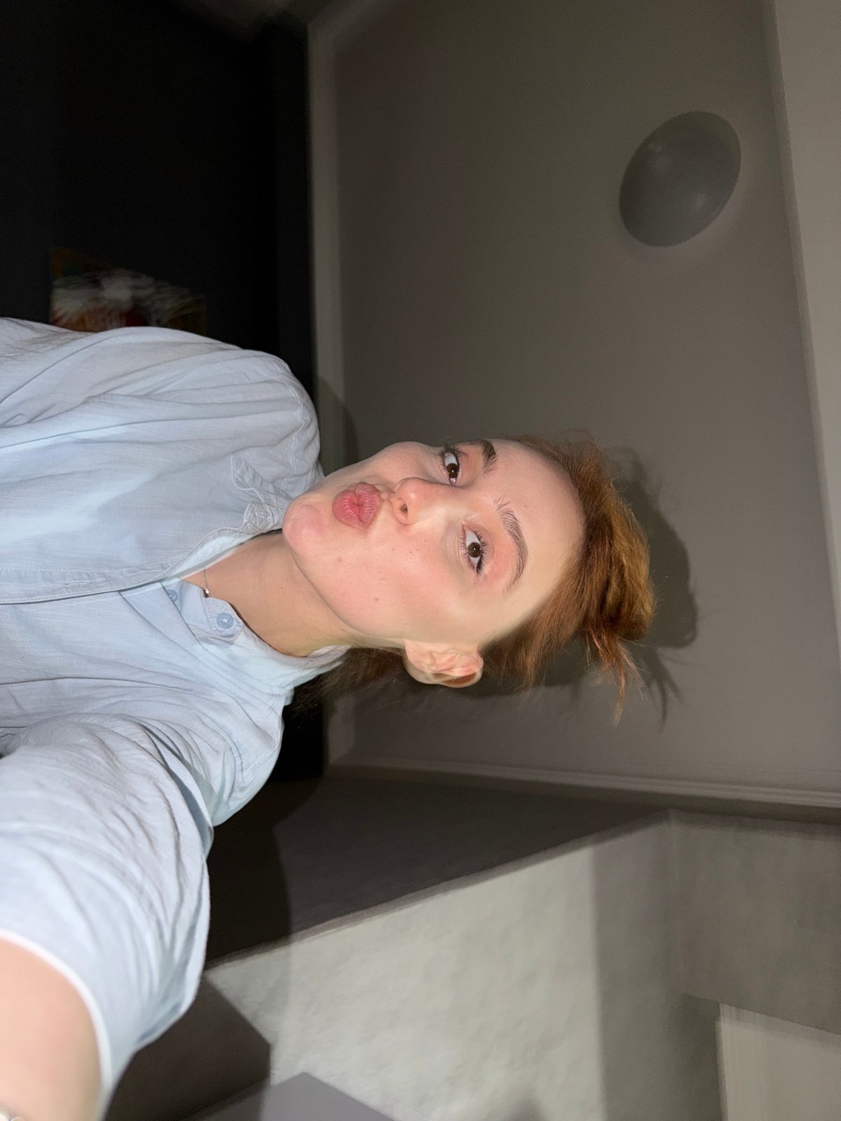 Woman takes selfie series in Tbilisi apartment