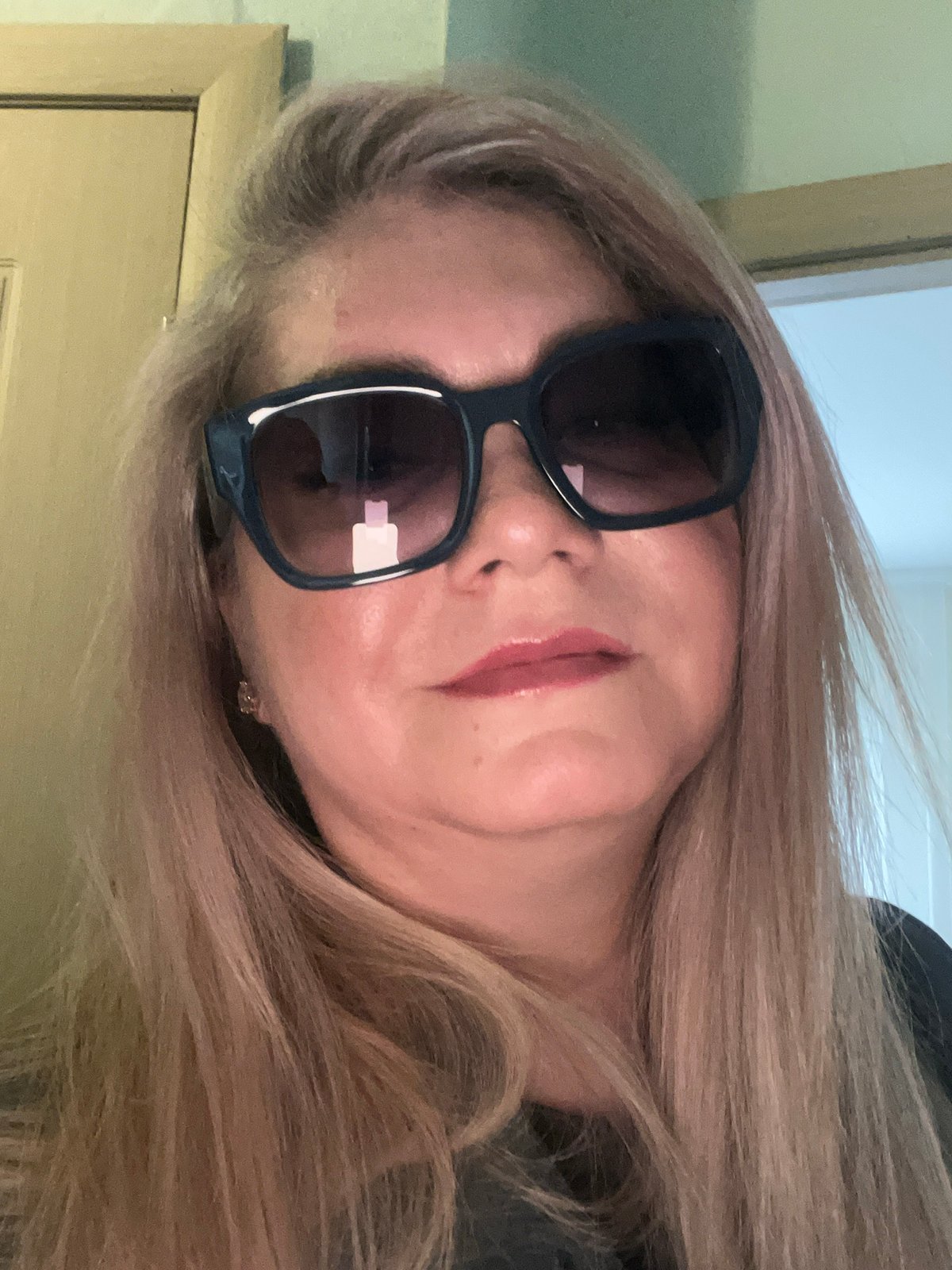 Woman takes bathroom mirror selfies in Izhevsk, Russia