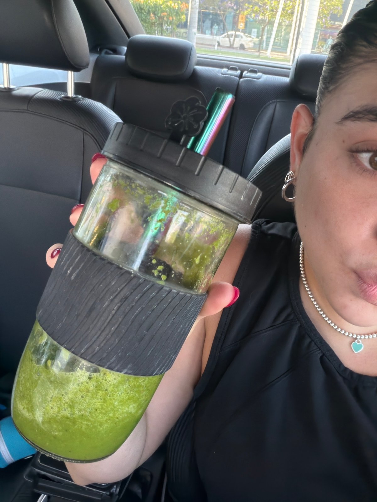 Person enjoys green smoothie in Puebla, Mexico