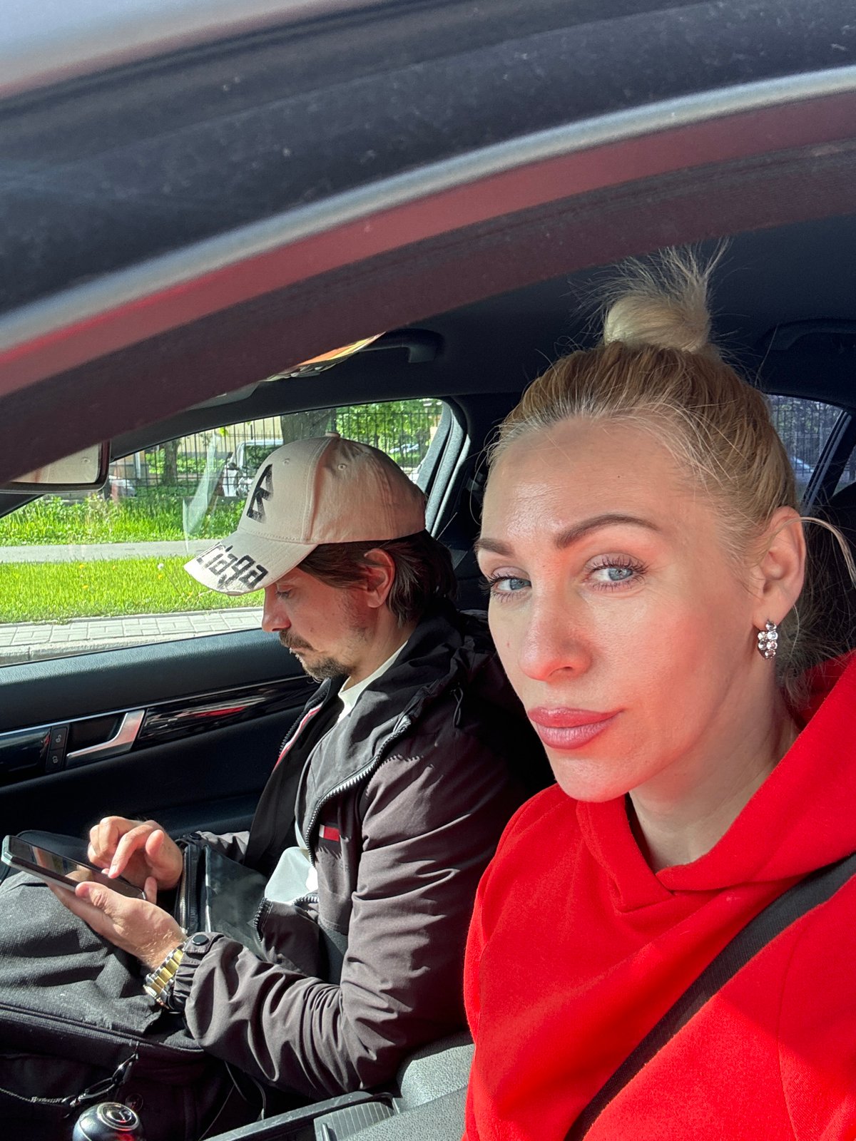 Woman in red hoodie documents daily errands across city