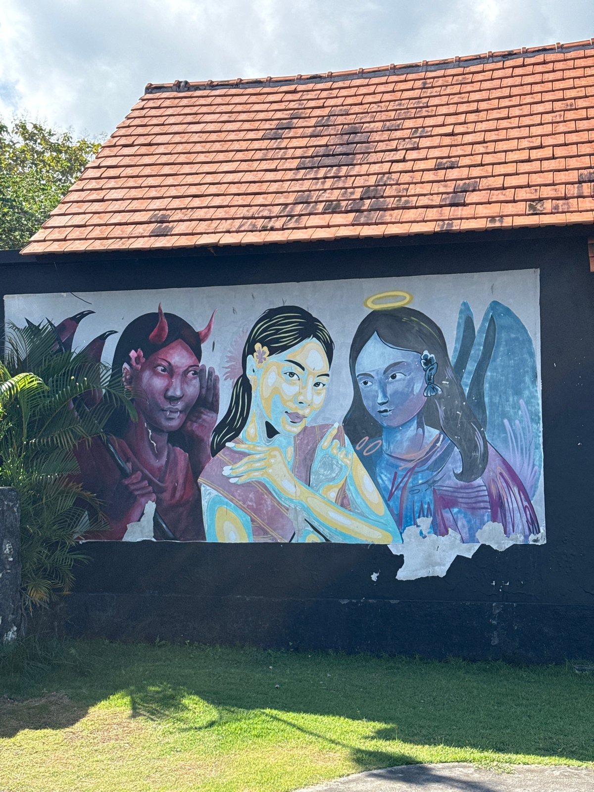 Angel, woman, devil mural spotted on Nusa Penida building