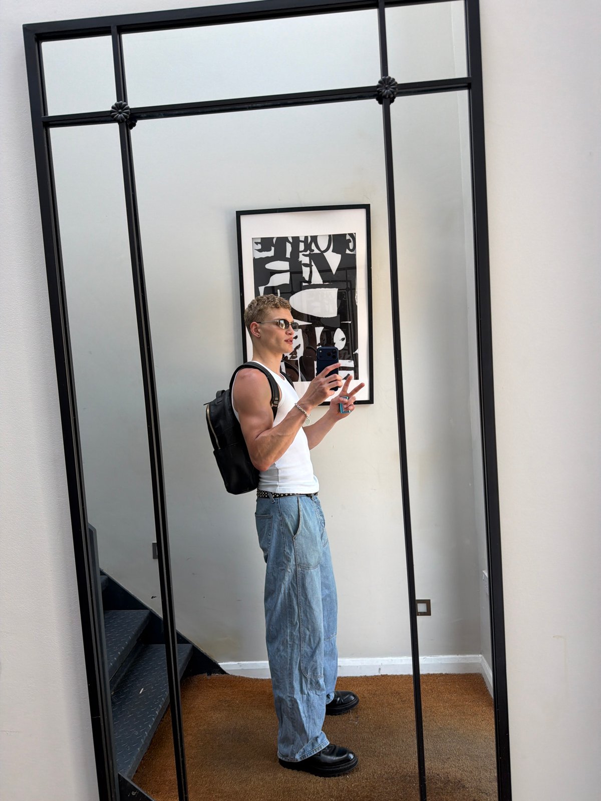 Man photographed in mirror reflection in London