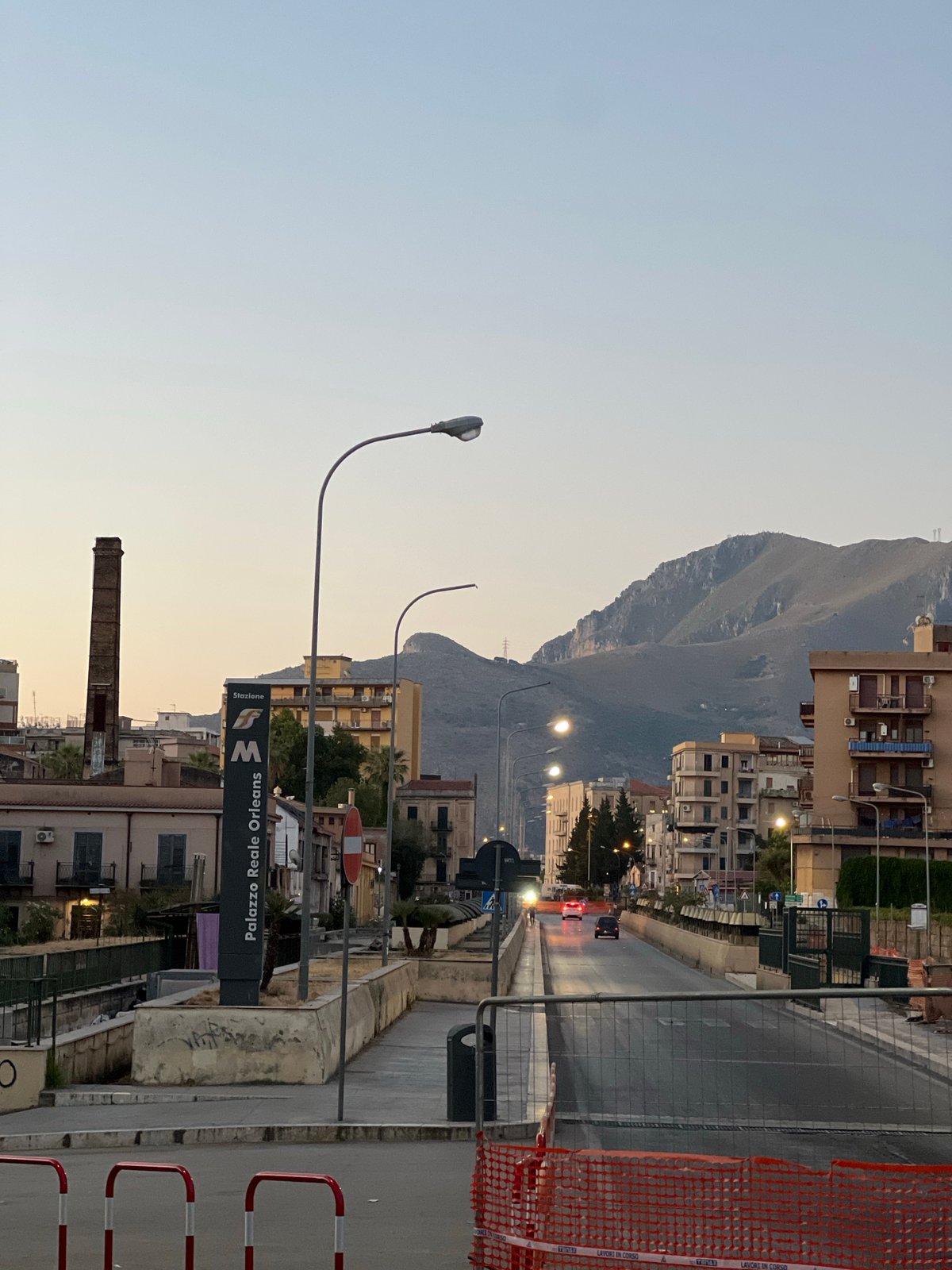 Palermo streets at dusk, quiet corners and mountain backdrop