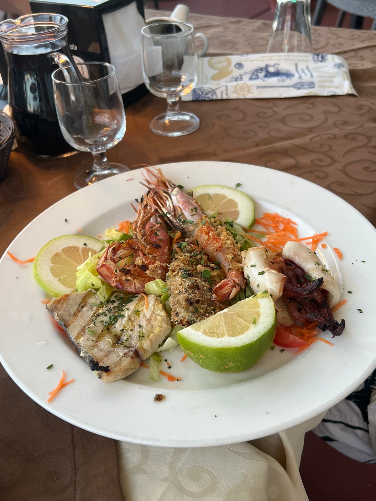 Evening seafood dining and sightseeing in coastal Letojanni, Italy