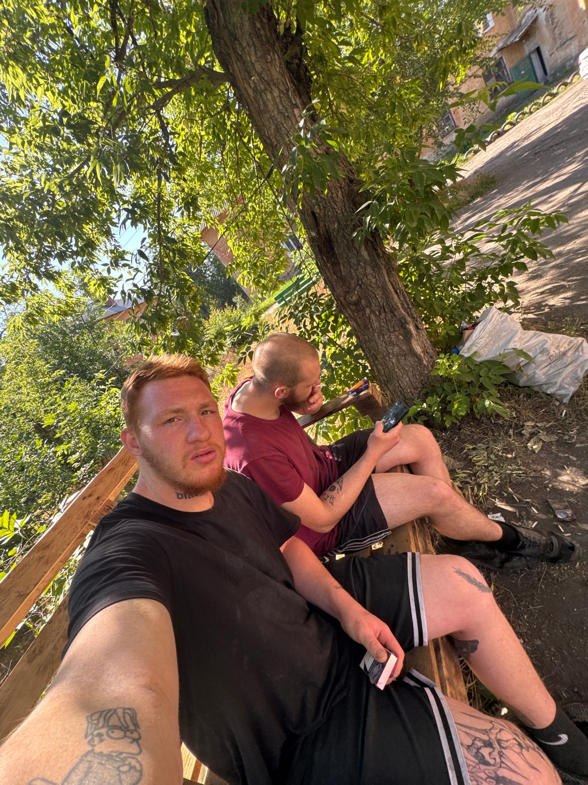 Friends, dogs, and hashtag posts in a sunny outdoor hangout