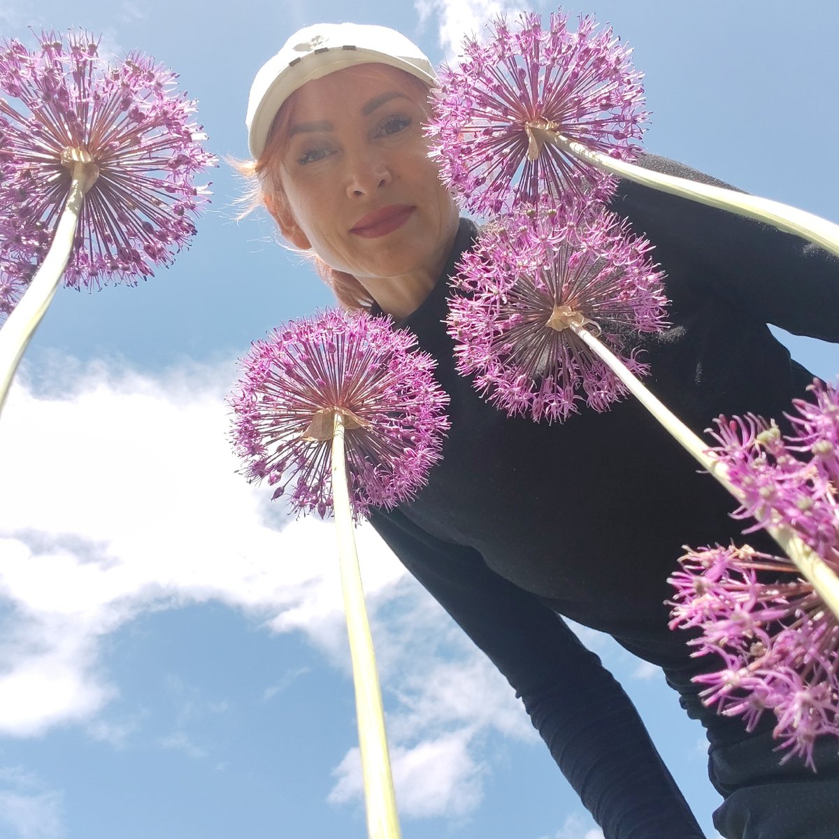 Woman cycles through Chaikovsky capturing spring flower photos