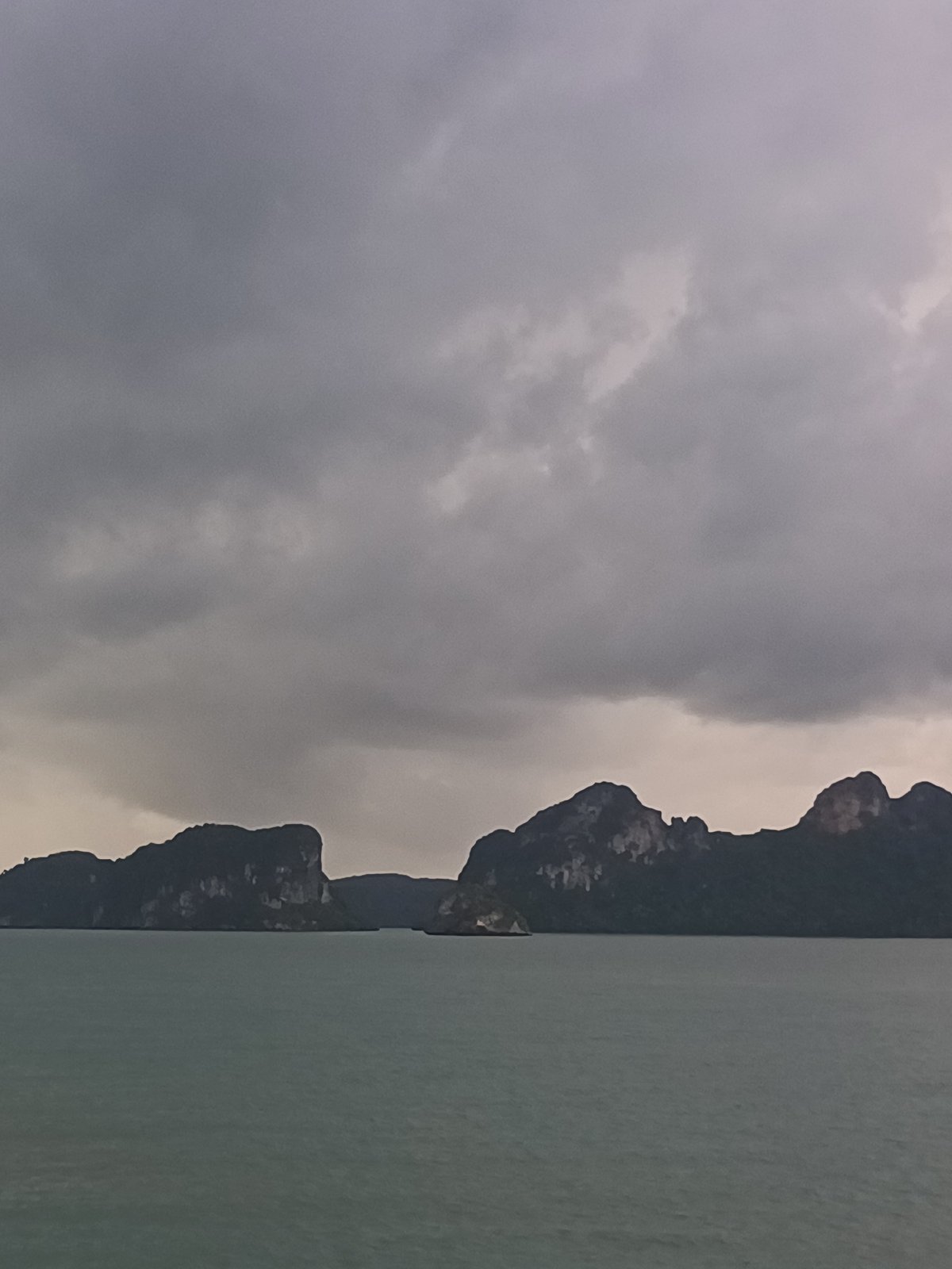 Ferry passenger documents cloudy Gulf crossing near Don Sak