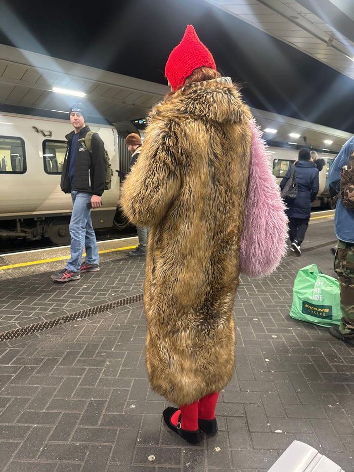 Colorfully dressed commuter spotted at London train station