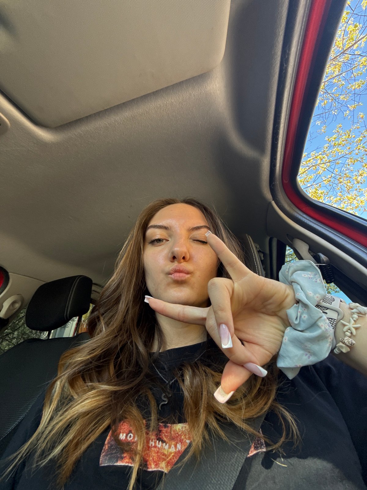 Woman takes selfie in car in Sofia, Bulgaria