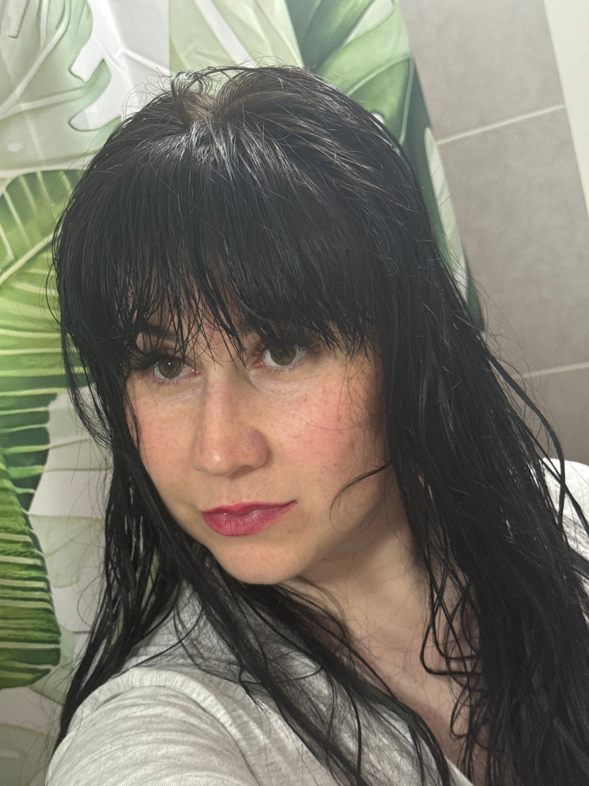 Woman's morning skincare routine documented in Zav'yalovo bathroom
