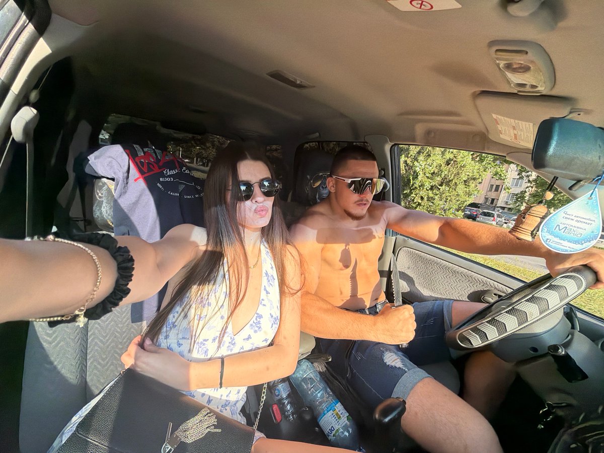 Woman takes selfie in passenger seat during daylight in Plovdiv
