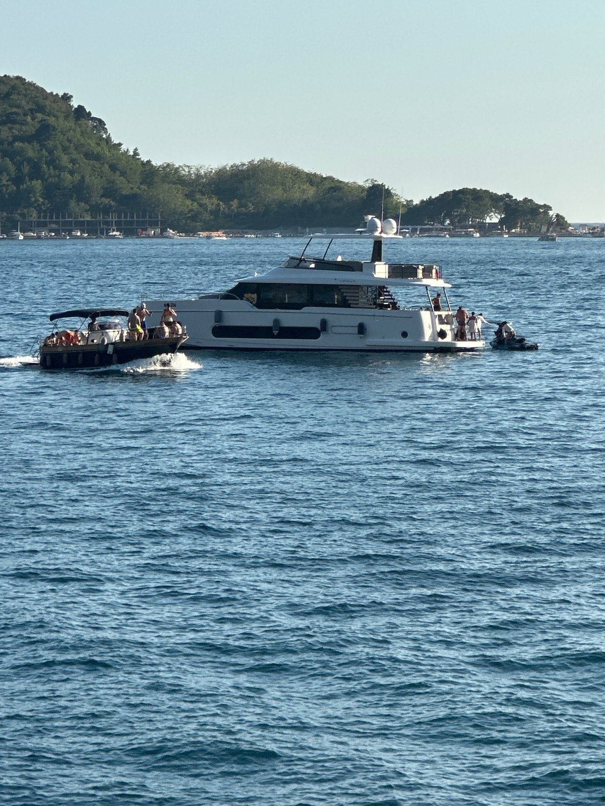 Boats and paddleboards on the Adriatic off Budva