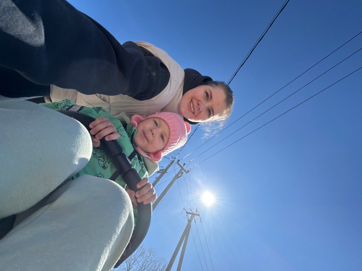 Mother and child enjoy sunny morning in Горный, Russia